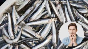 Acciughe e uomo preoccupato